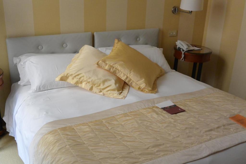 Postel nebo postele na pokoji v ubytování Hotel Gran Duca Di York