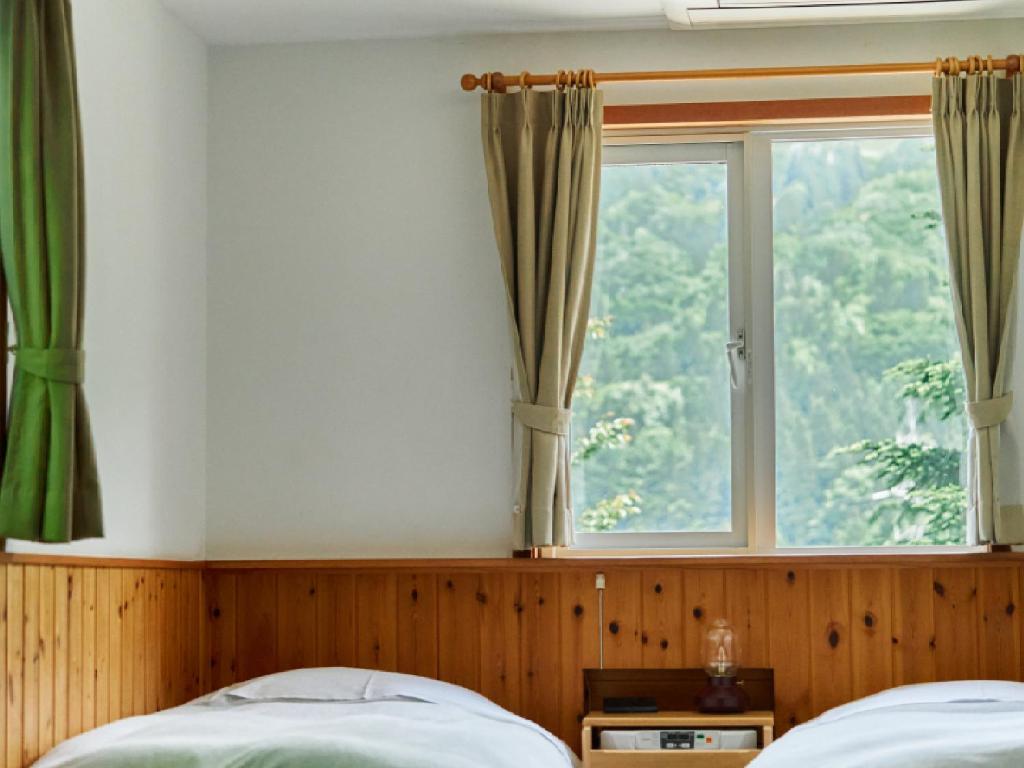 Postel nebo postele na pokoji v ubytování Pension Asanebou