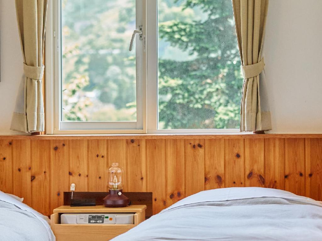 Postel nebo postele na pokoji v ubytování Pension Asanebou