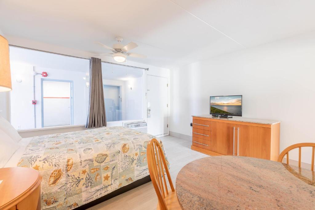 Postel nebo postele na pokoji v ubytování Premiere Motel