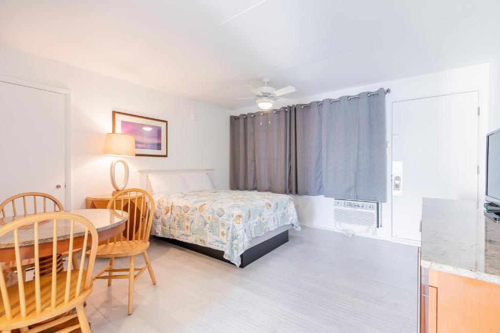 Postel nebo postele na pokoji v ubytování Premiere Motel