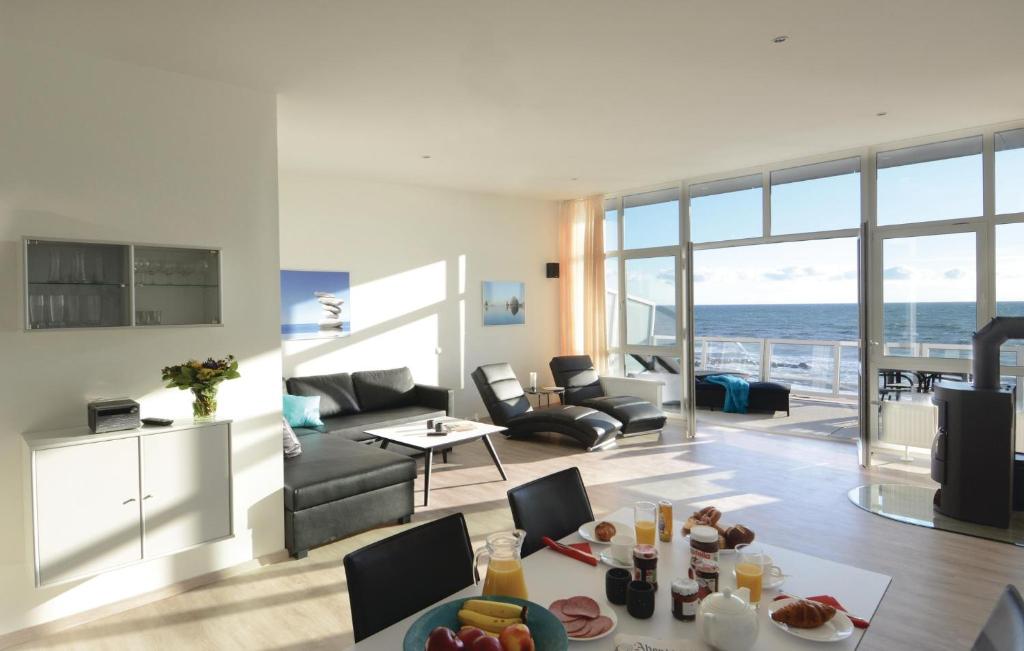 a living room with a view of the ocean at Appartement Seestern C in Schönhagen