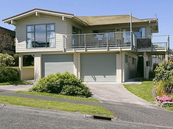 a large house with a balcony and a driveway at Golders Heights - Taupo Holiday Home in Taupo