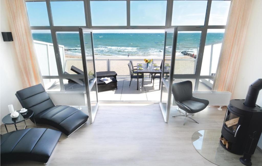 a living room with a view of the ocean at Appartement Seestern A in Schönhagen