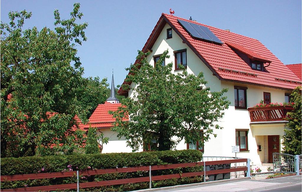 a white house with a red roof at Amazing Apartment In Nahetal-waldau With 2 Bedrooms, Sauna And Wifi in Hinternah