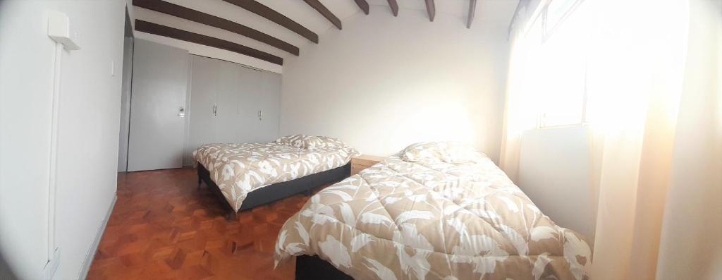 Postel nebo postele na pokoji v ubytování Casa Jaguar Manizales sector Cable
