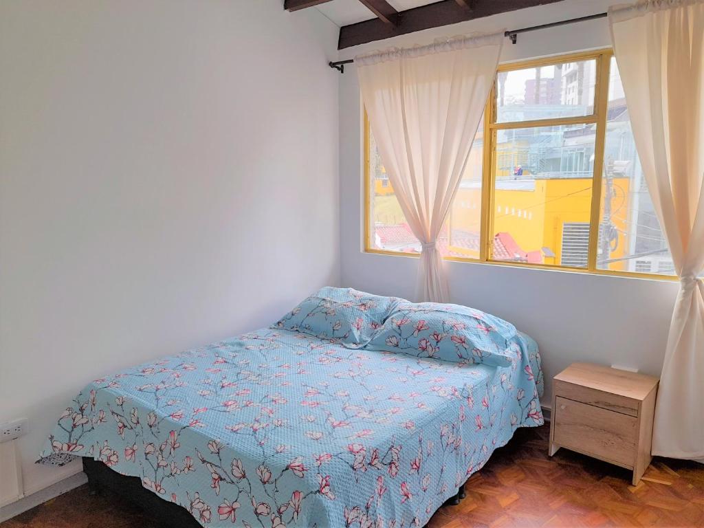 Postel nebo postele na pokoji v ubytování Casa Jaguar Manizales sector Cable