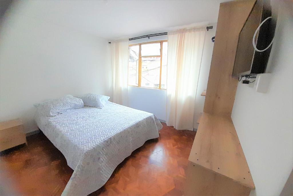 Postel nebo postele na pokoji v ubytování Casa Jaguar Manizales sector Cable