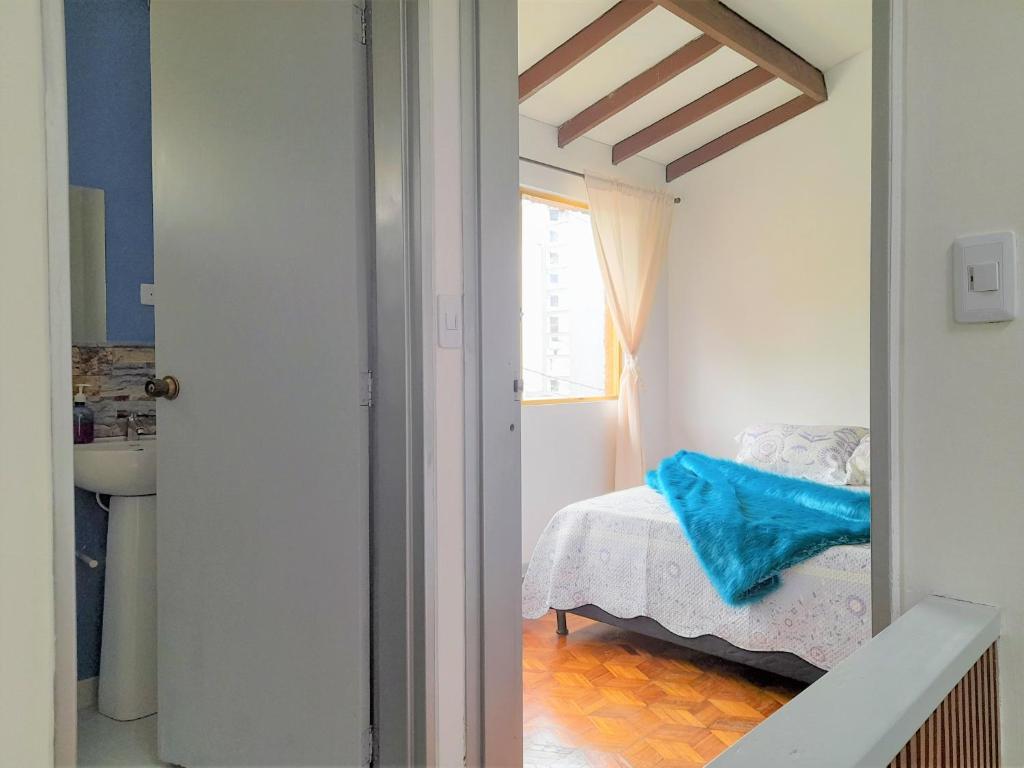 Postel nebo postele na pokoji v ubytování Casa Jaguar Manizales sector Cable