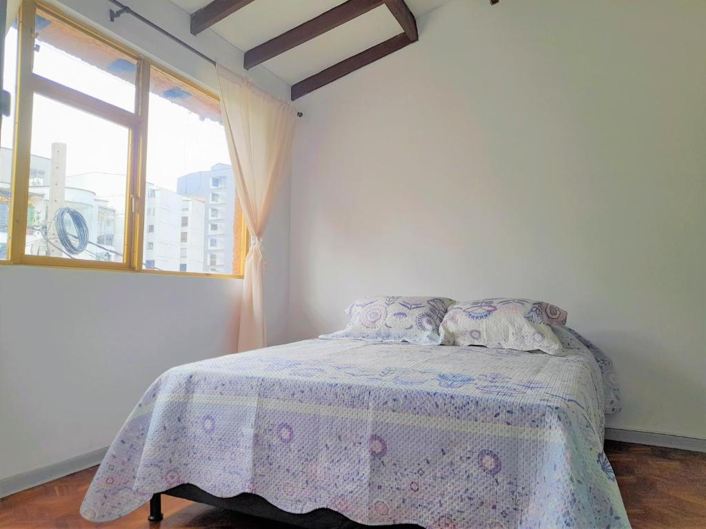 Postel nebo postele na pokoji v ubytování Casa Jaguar Manizales sector Cable