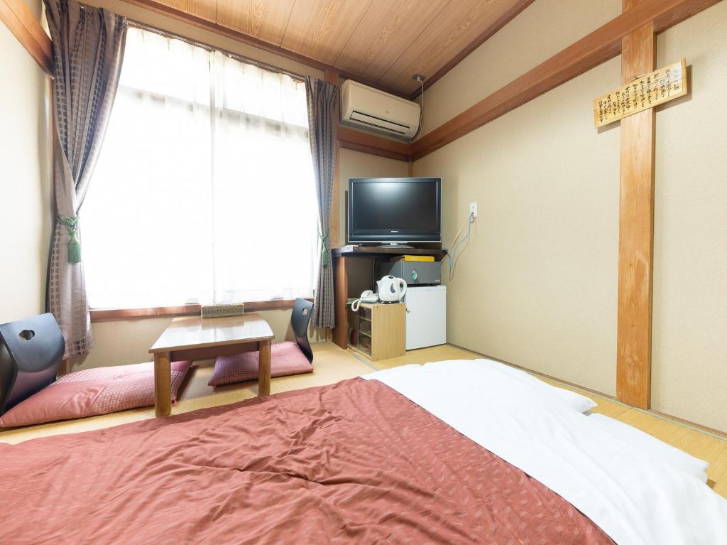 TV a/nebo společenská místnost v ubytování Tabist Hotel Iyashi no Sato