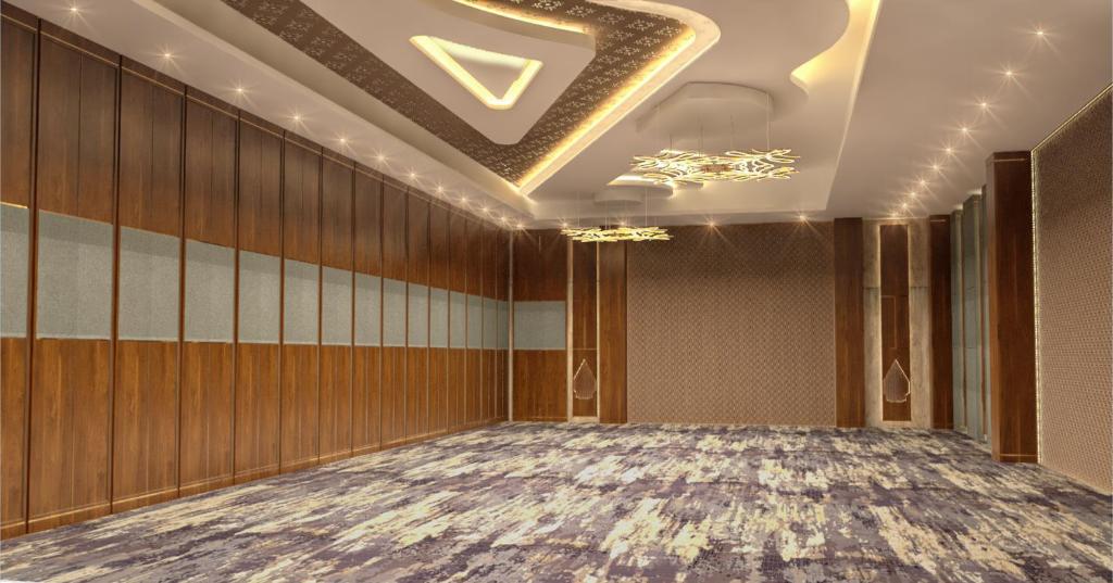 Postel nebo postele na pokoji v ubytování Hotel Santika Gunungkidul