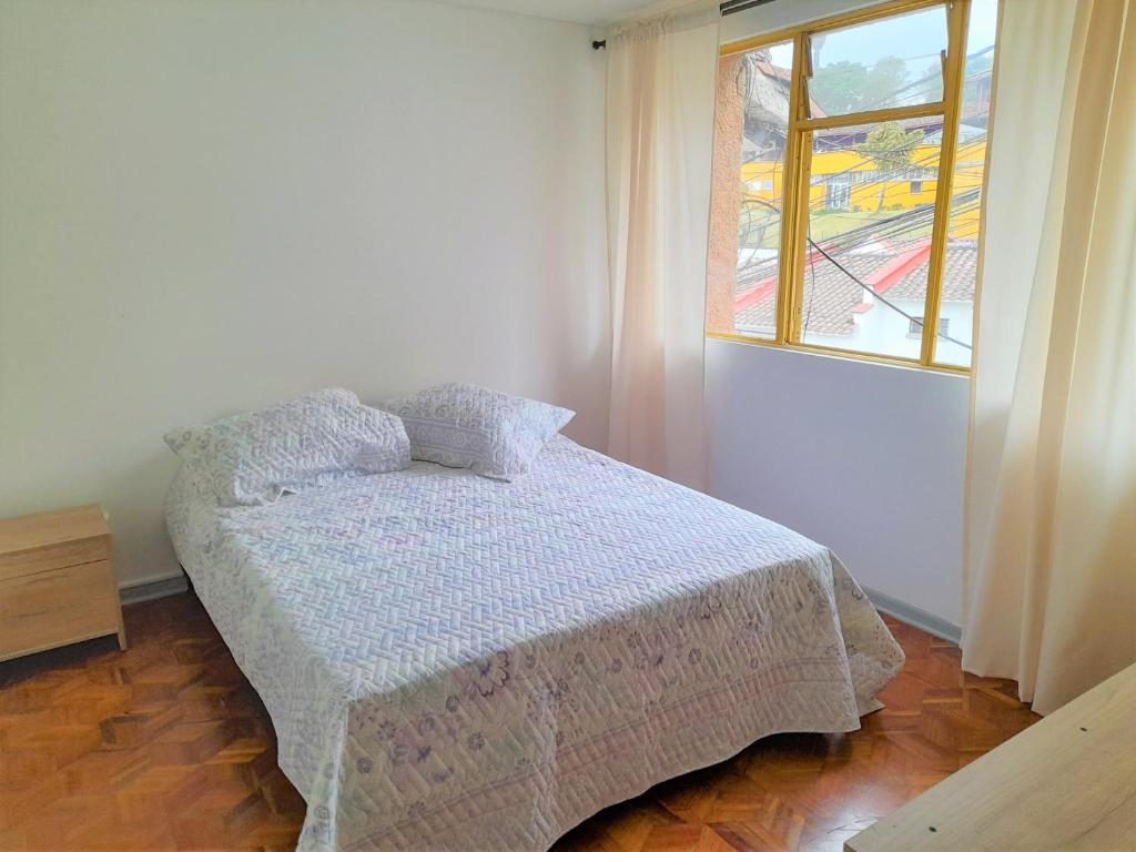 Postel nebo postele na pokoji v ubytování Casa Jaguar Manizales sector Cable