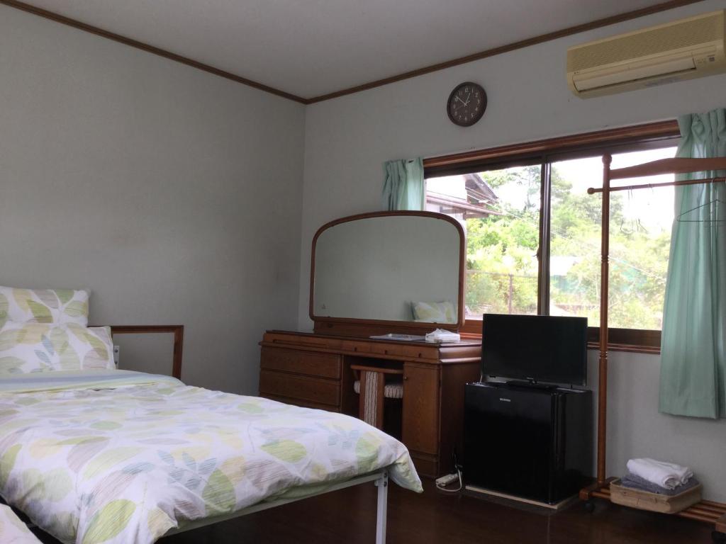 Postel nebo postele na pokoji v ubytování Guesthouse Yui