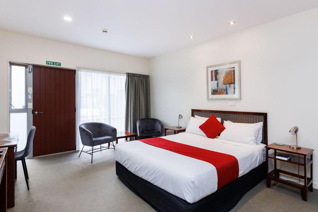 Letto o letti in una camera di Fitzherbert Regency Motor Lodge