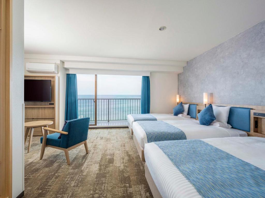 Postel nebo postele na pokoji v ubytování Atagawa Ocean Resort