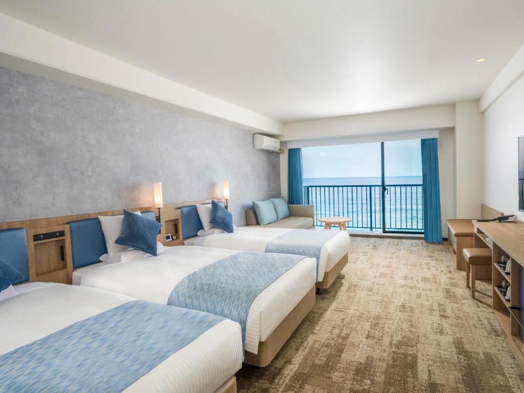 Postel nebo postele na pokoji v ubytování Atagawa Ocean Resort