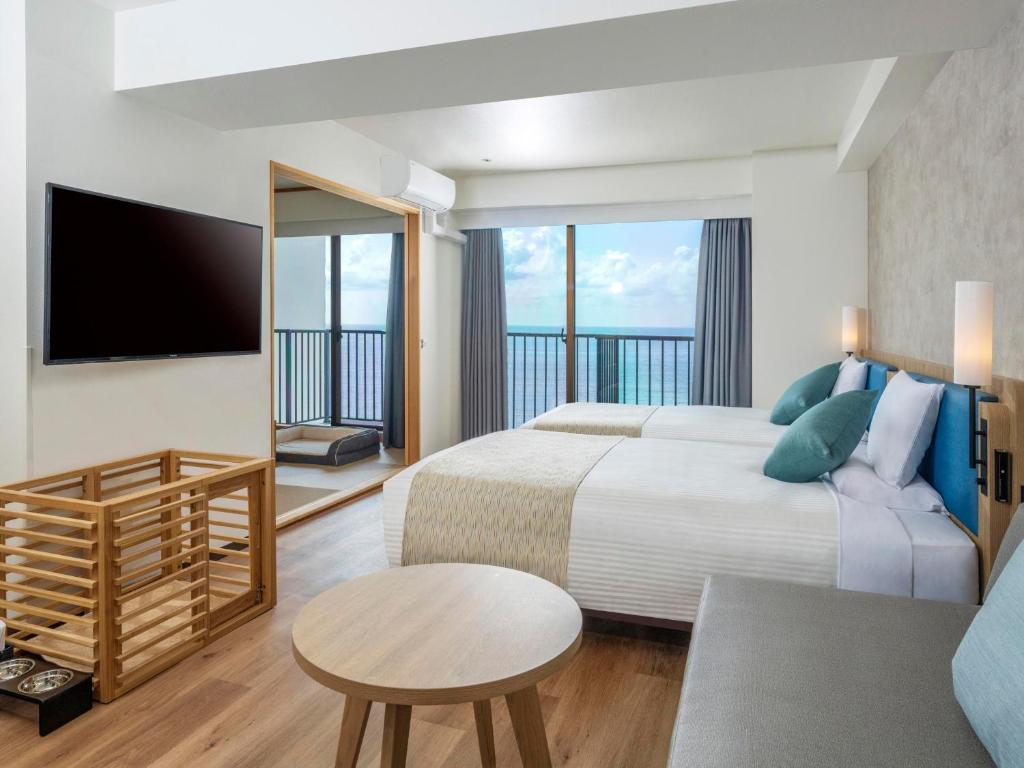 Postel nebo postele na pokoji v ubytování Atagawa Ocean Resort