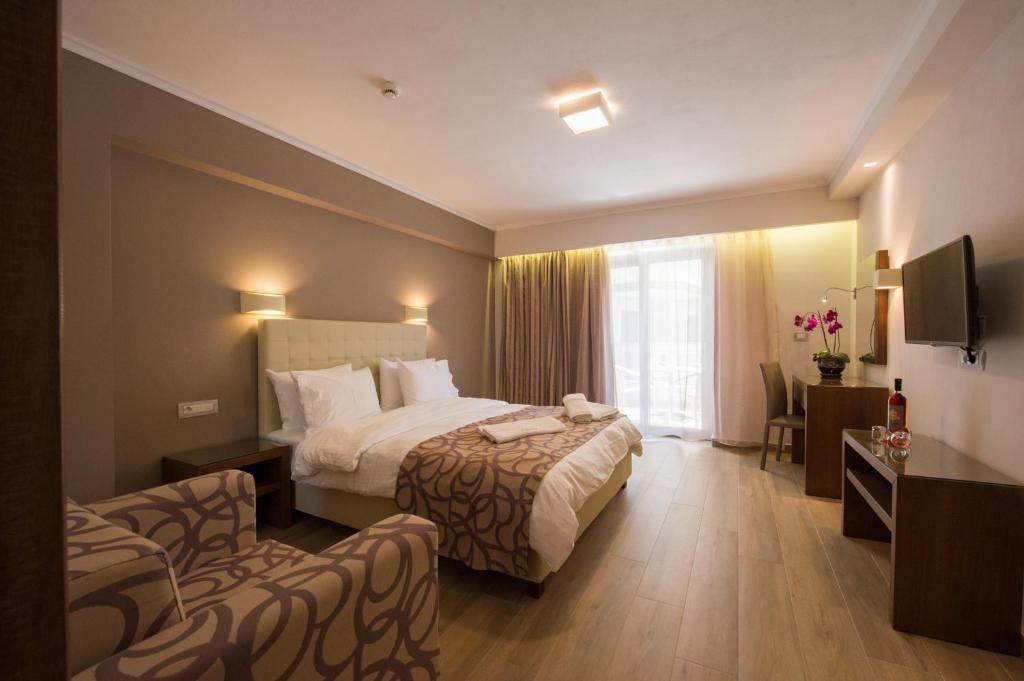 Voodi või voodid majutusasutuse Adams Hotel toas