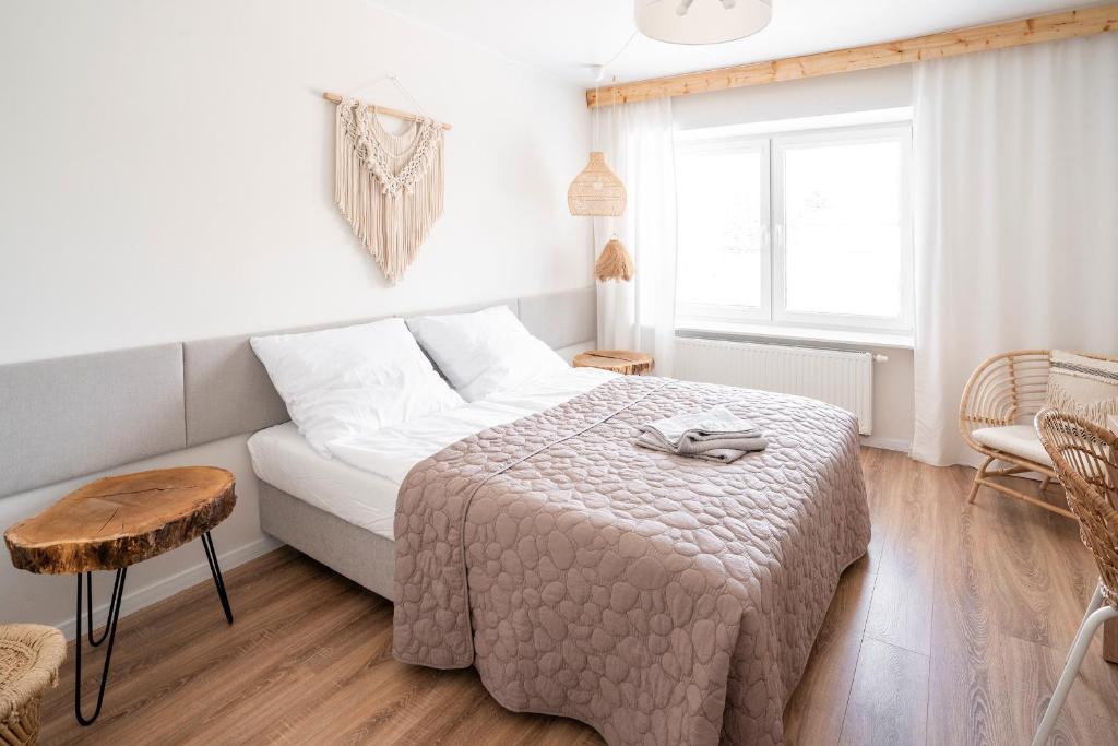 Ένα ή περισσότερα κρεβάτια σε δωμάτιο στο BOHO Apartments