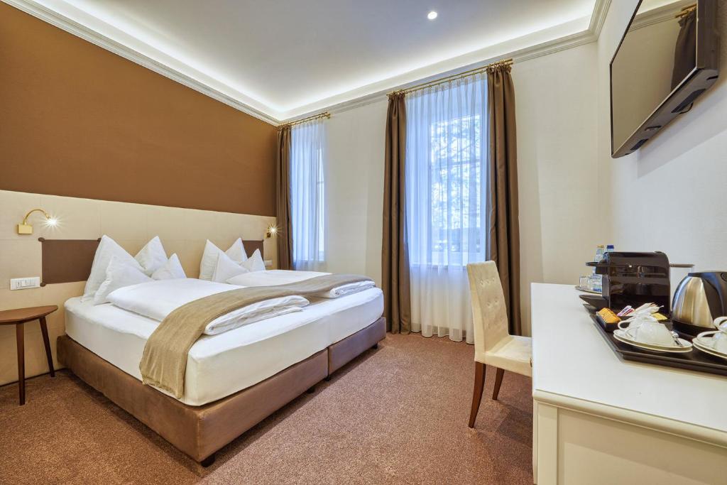 Postel nebo postele na pokoji v ubytování Villa Tell rooms and suites