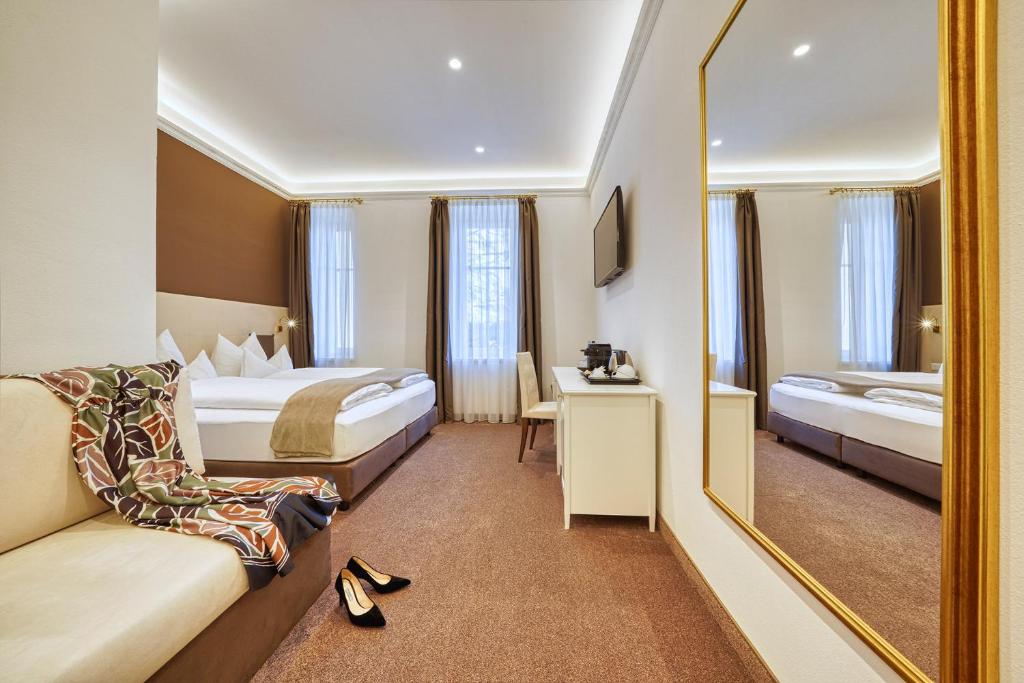 Postel nebo postele na pokoji v ubytování Villa Tell rooms and suites