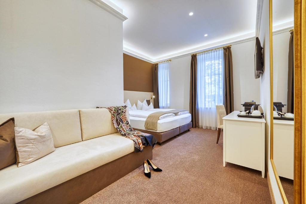 Postel nebo postele na pokoji v ubytování Villa Tell rooms and suites