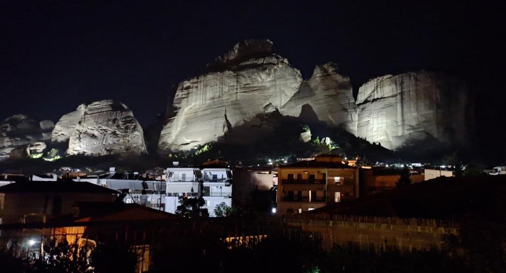 a view of the mountains at night at FAMILY APARTMENT Meteora in Kalabaka