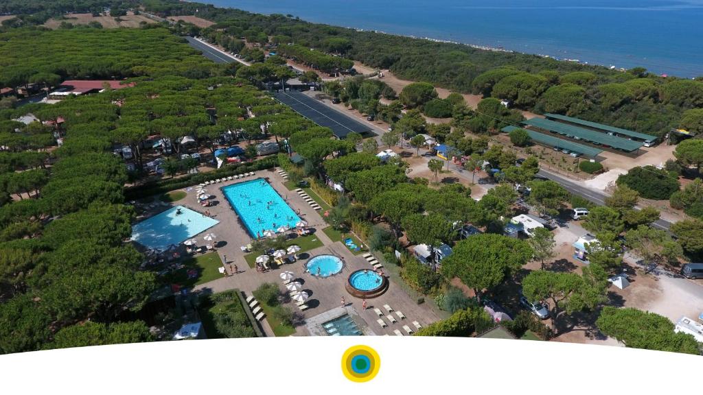 an overhead view of a resort with two pools at Orbetello Family Camping Village in Orbetello
