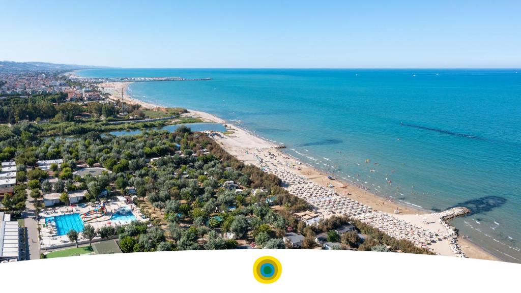 an aerial view of a beach and the ocean at Stork Family Camping Village in Giulianova