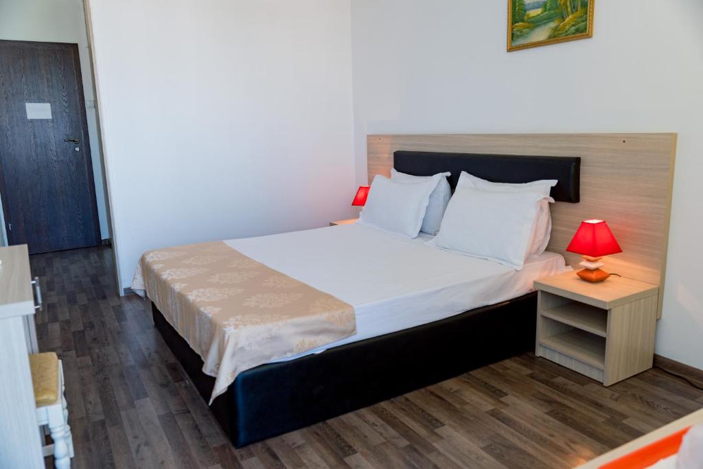 Postel nebo postele na pokoji v ubytování Hotel Apollo