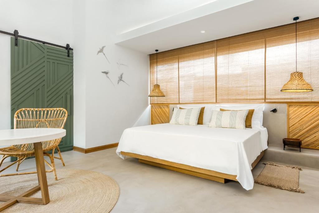 Кровать или кровати в номере Sunrise Attitude (Adults Only)