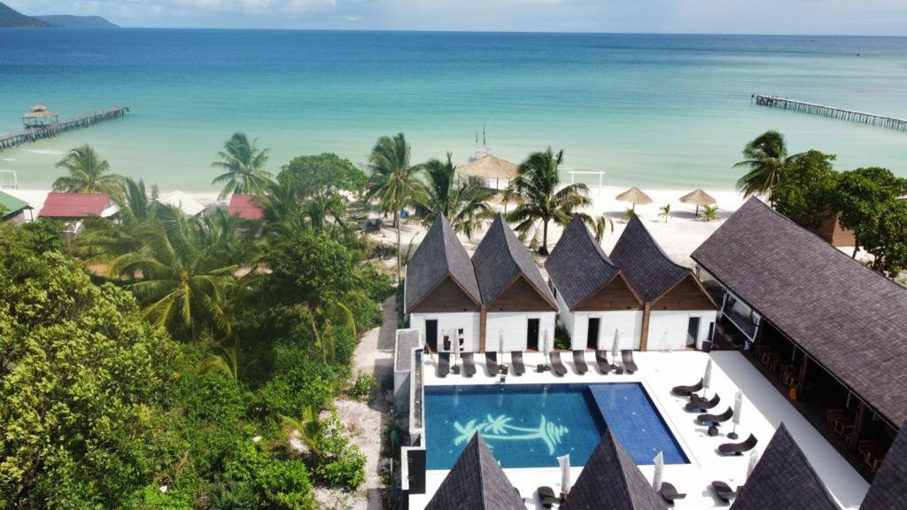 an aerial view of a resort with a swimming pool and the beach at Golden Beach Resort in Koh Rong Island