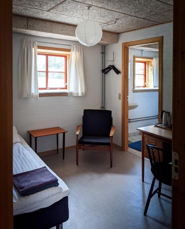 Postel nebo postele na pokoji v ubytování Skærum Mølle