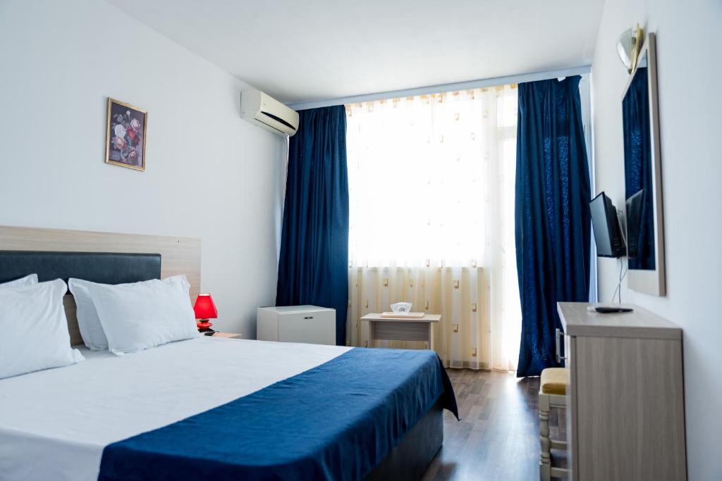 Postel nebo postele na pokoji v ubytování Hotel Apollo