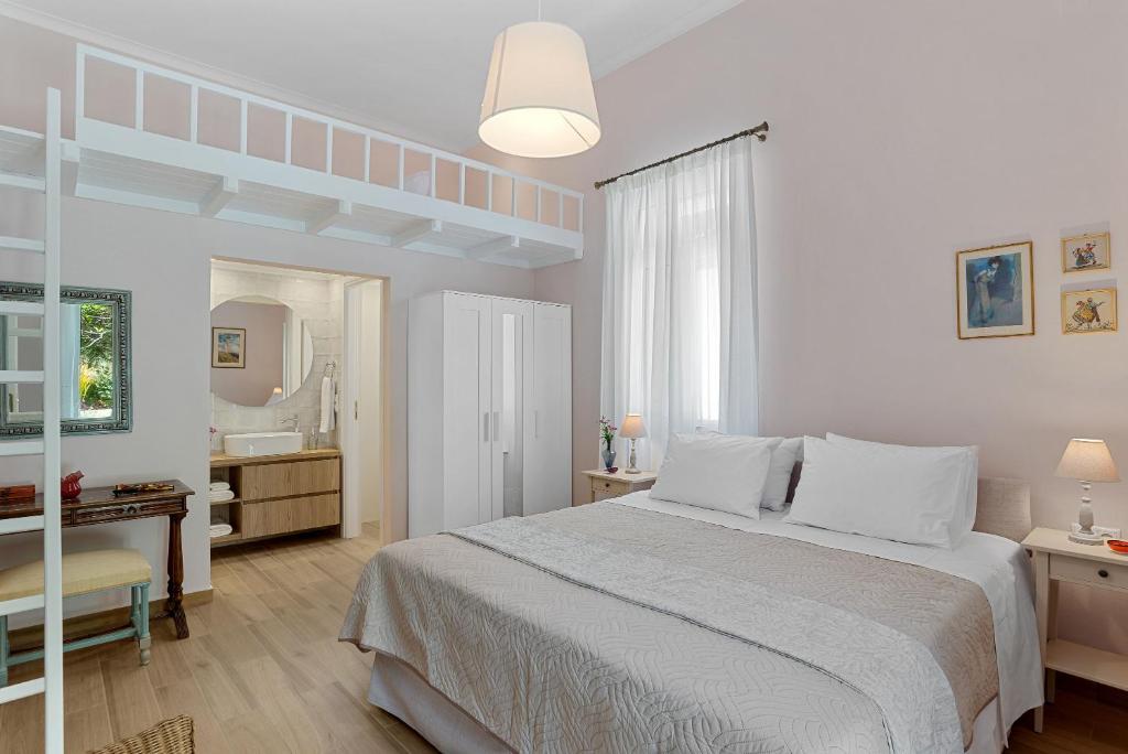 Łóżko lub łóżka w pokoju w obiekcie Villa Remedio