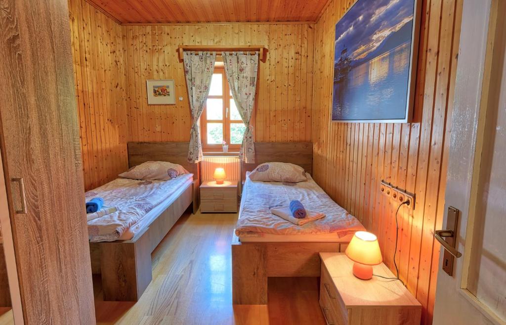 Postel nebo postele na pokoji v ubytování Jacobs Resort House Planica