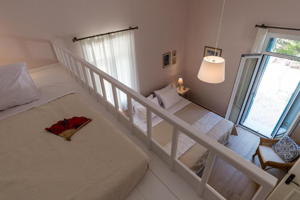 Łóżko lub łóżka w pokoju w obiekcie Villa Remedio