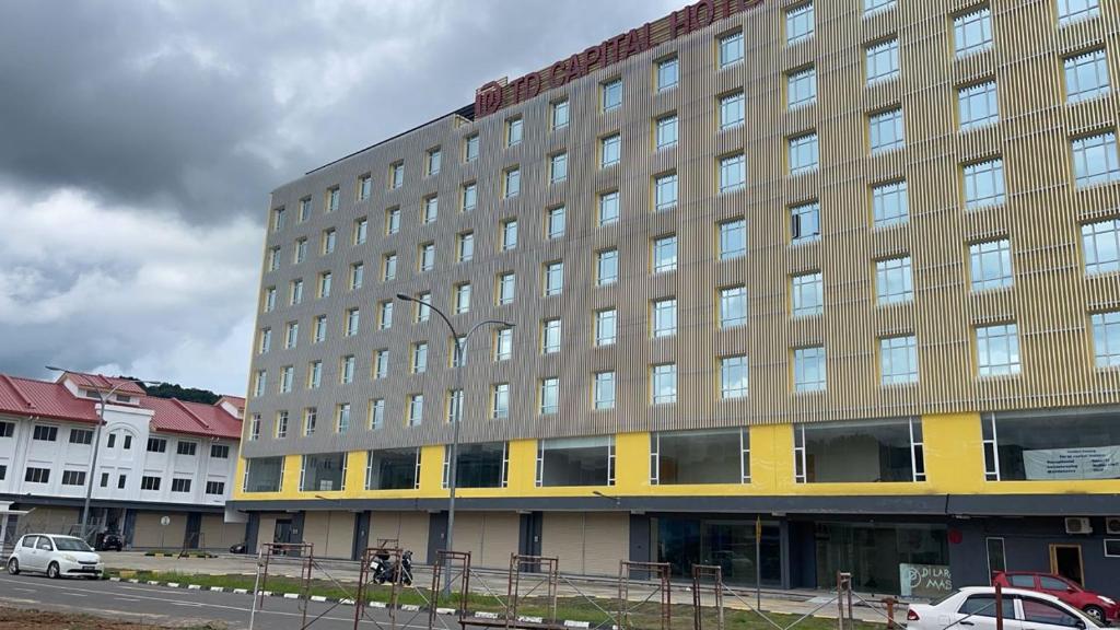 a large building on the side of a street at TD CAPITAL HOTEL in Inanam