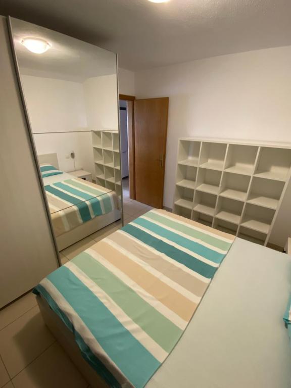 Postel nebo postele na pokoji v ubytování Apartments Kristina