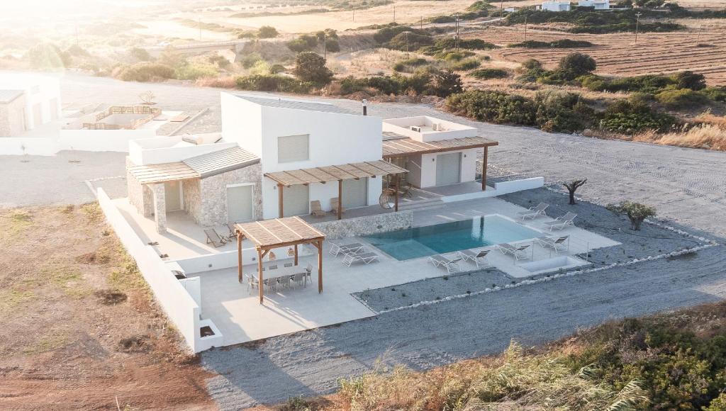 an aerial view of a white house with a swimming pool at Alykes Beachside Stylish Villas with Private Pool South Rhodes in Lakhania