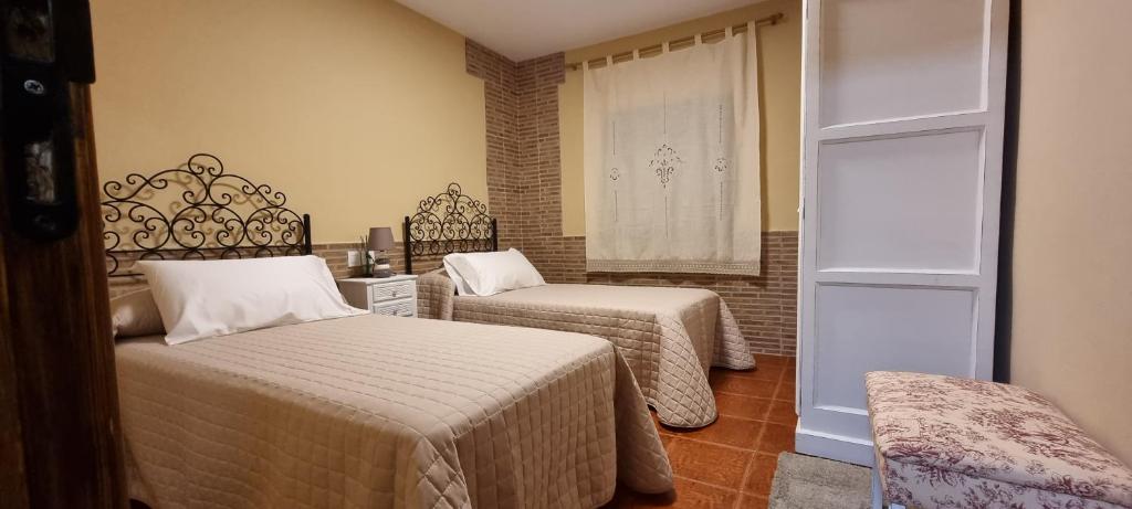Postel nebo postele na pokoji v ubytování Apartamento Turistico "El Rincón de la Pernila"