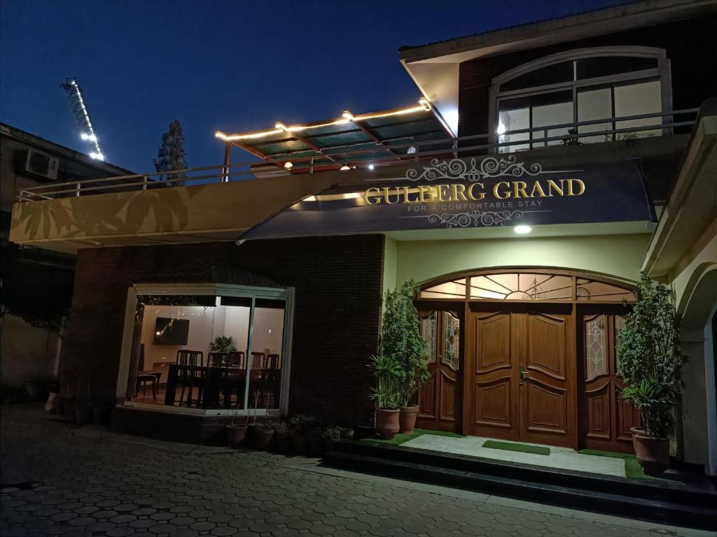 a building with a sign that reads gathering grand at Hotel Gulberg Grand in Lahore