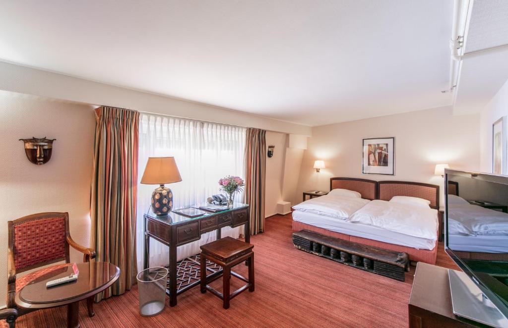 Postel nebo postele na pokoji v ubytování Hotel Victoria