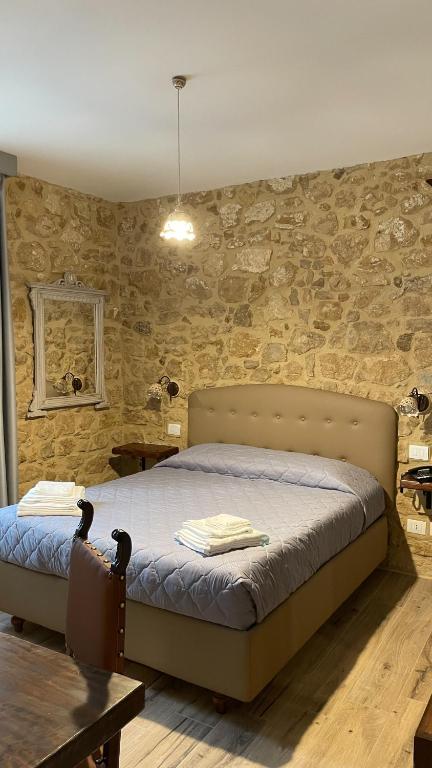 Postel nebo postele na pokoji v ubytování Agriturismo Borgo Furma