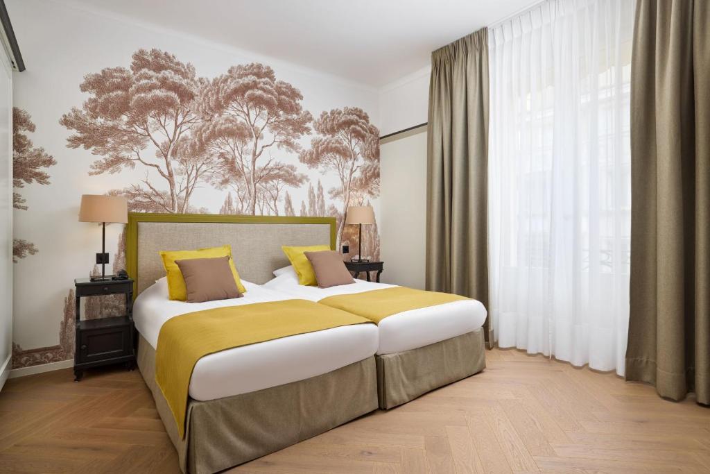 Postel nebo postele na pokoji v ubytování Hotel Victoria