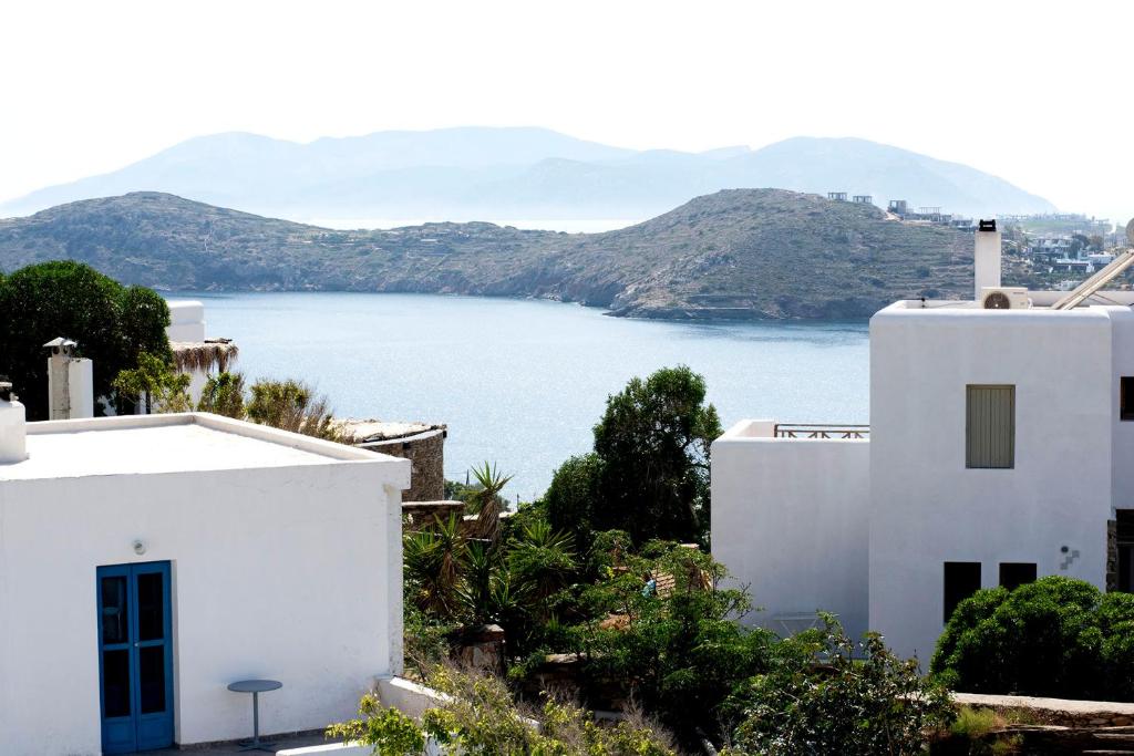 a white house with a view of a body of water at Ios Penelope in Ios Chora