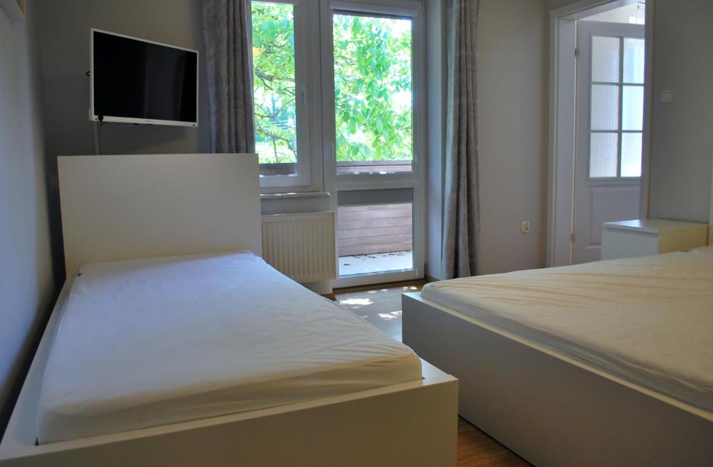 Postel nebo postele na pokoji v ubytování Pokoje Gościnne Beata