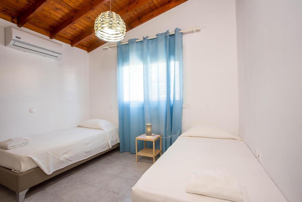 Posteľ alebo postele v izbe v ubytovaní Platanos House