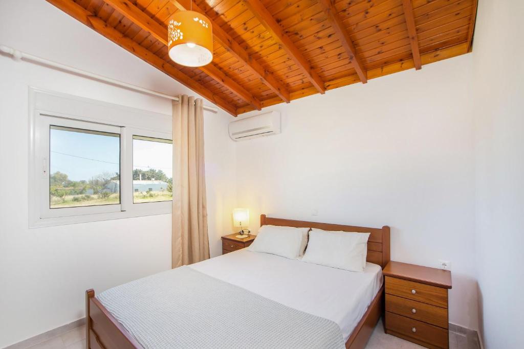 Posteľ alebo postele v izbe v ubytovaní Platanos House